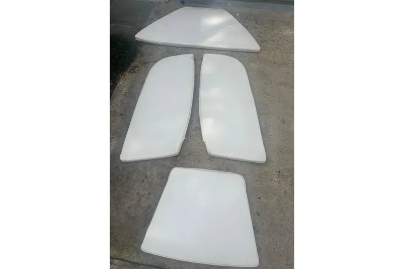 Slide: The Image of White boat cushions for 2019 Robalo 226 Cayman, displayed on concrete surface. - 67