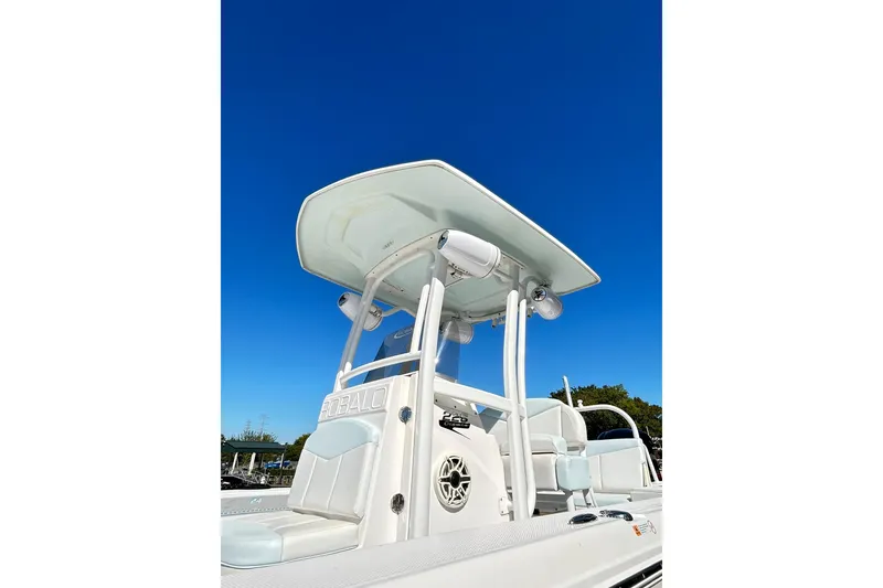 Slide: The Image of 2019 Robalo 226 Cayman boat with T-top against clear blue sky. - 9