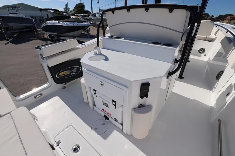 Slide: The Image of 2026 Sea Hunt Ultra 275 SE boat interior with seating and storage features. - 21