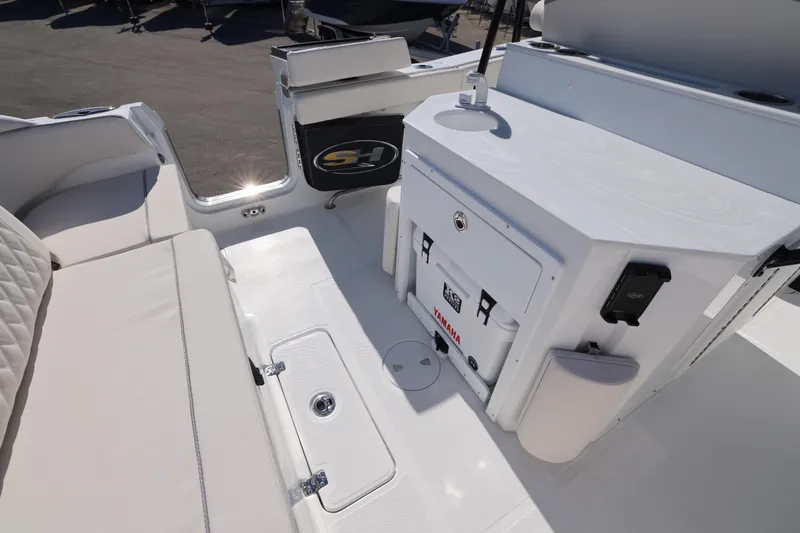 Slide: The Image of 2026 Sea Hunt Ultra 275 SE boat interior with seating and storage compartments. - 22