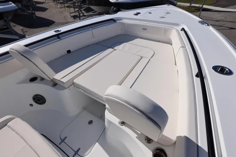 Slide: The Image of 2026 Sea Hunt Ultra 275 SE boat interior with white cushioned seating. - 3