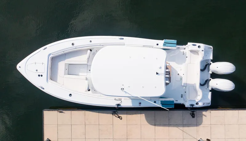 Slide: The Image of Aerial view of 2026 Sea Hunt Ultra 275 SE boat docked at a pier. - 38