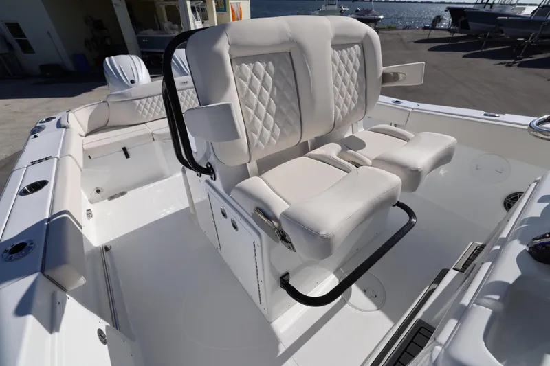 Slide: The Image of 2026 Sea Hunt Ultra 275 SE boat with luxurious white seating and sleek design. - 7