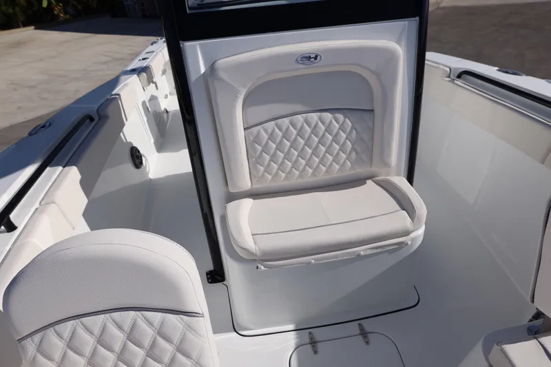 Slide: The Image of 2026 Sea Hunt Ultra 275 SE boat interior with white cushioned seating. - 9