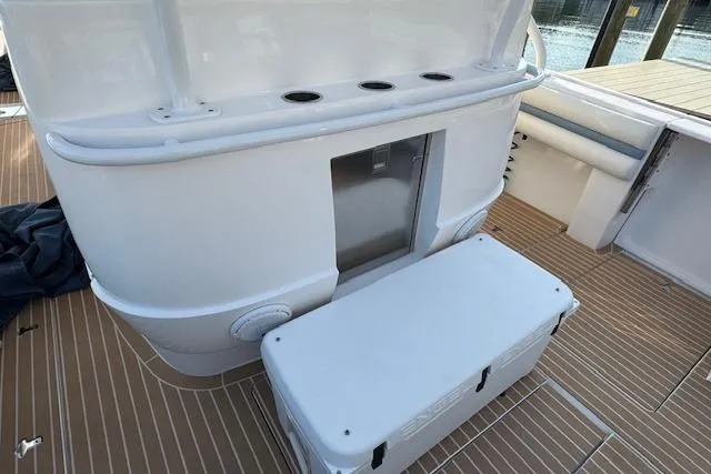Slide: The Image of 2016 Intrepid 475 Panacea boat deck with storage and seating area. - 16