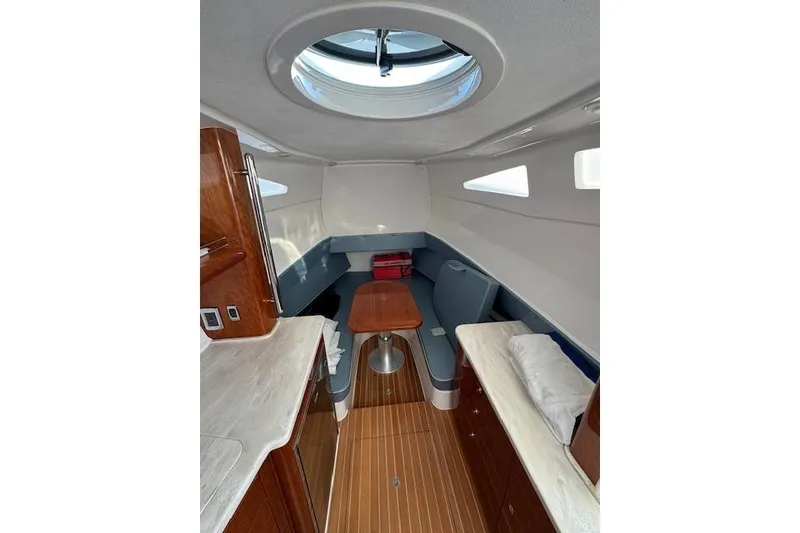 Slide: The Image of Interior of 2016 Intrepid 475 Panacea boat with seating and table. - 21