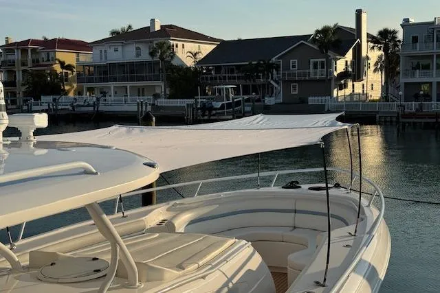 Slide: The Image of Intrepid 475 Panacea 2016 boat docked near waterfront homes at sunset. - 7