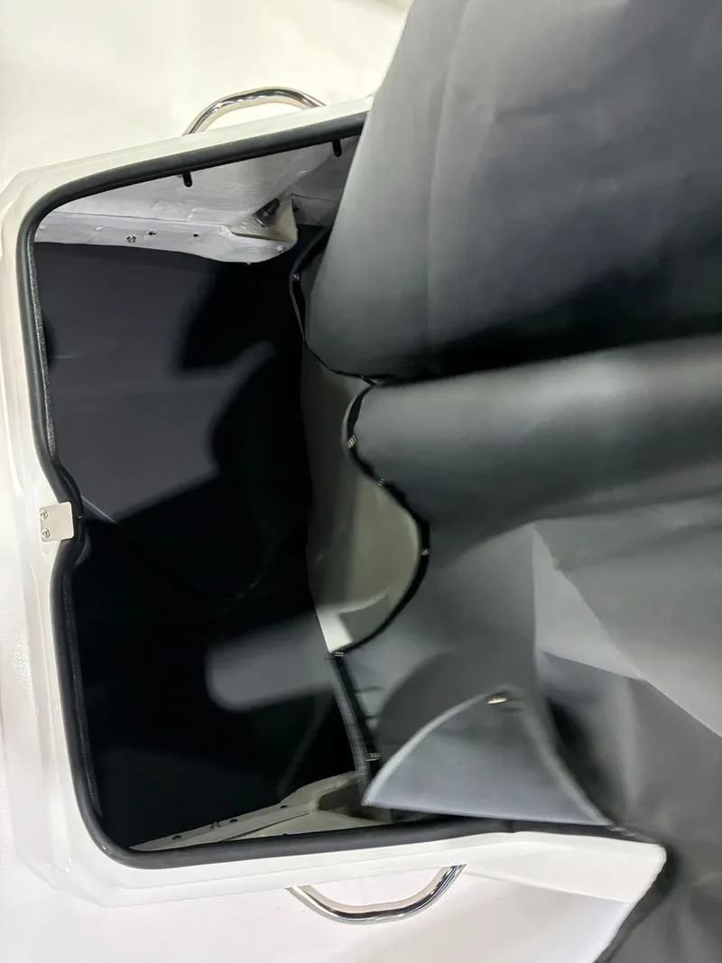 Slide: The Image of Interior view of Yamaha Boats 222 FSH Sport 2026 storage compartment. - 15