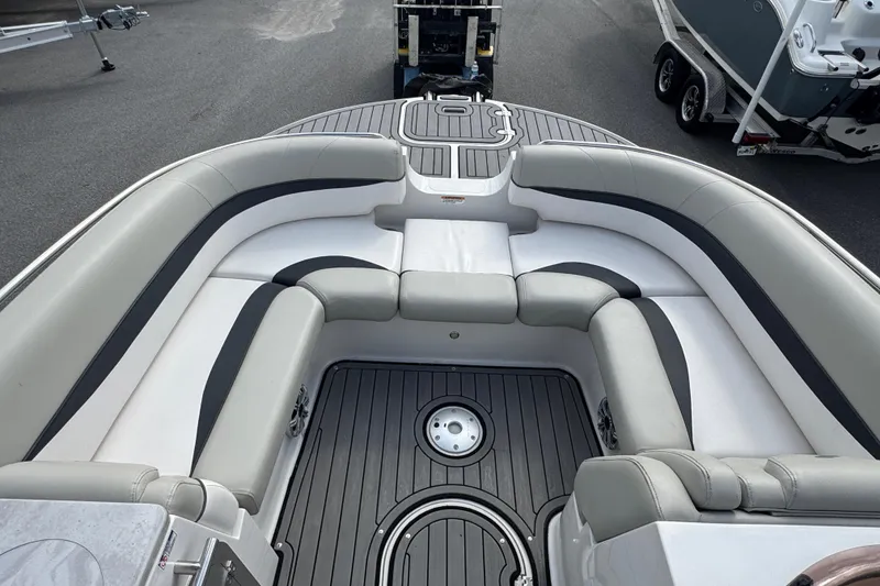 Slide: The Image of 2019 Starcraft Star Step 221 I/O boat interior with gray seating and deck. - 11