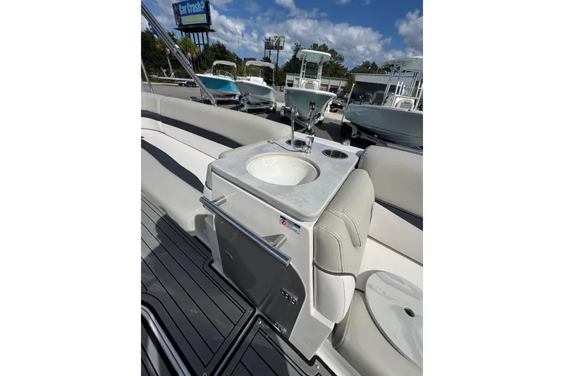 Slide: The Image of 2019 Starcraft Star Step 221 I/O boat interior with seating and sink. - 13
