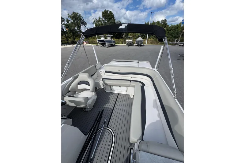Slide: The Image of 2019 Starcraft Star Step 221 I/O boat interior with seating and canopy. - 14