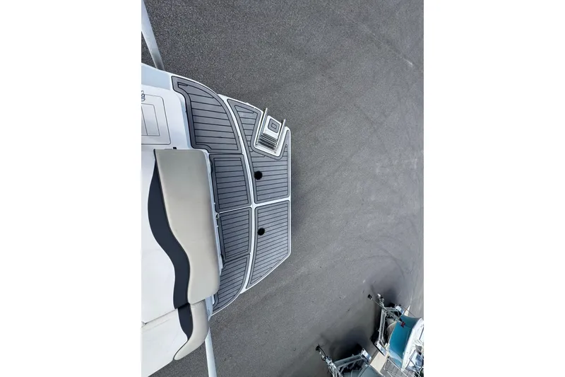 Slide: The Image of 2019 Starcraft Star Step 221 I/O boat deck with gray non-slip surface. - 16