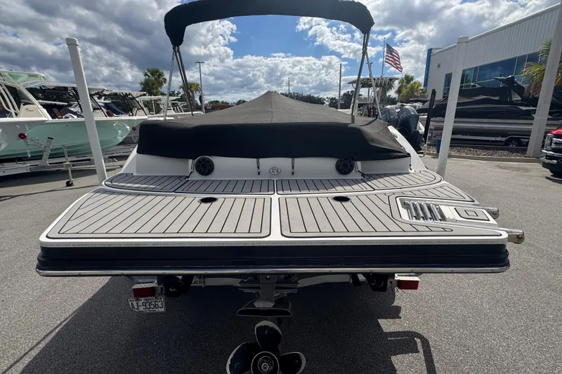 Slide: The Image of 2019 Starcraft Star Step 221 I/O boat with covered deck, parked outdoors. - 5