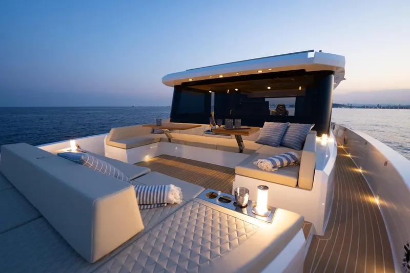 Slide: The Image of Luxurious 2026 De Antonio Yachts D60 with elegant deck seating at sunset. - 11
