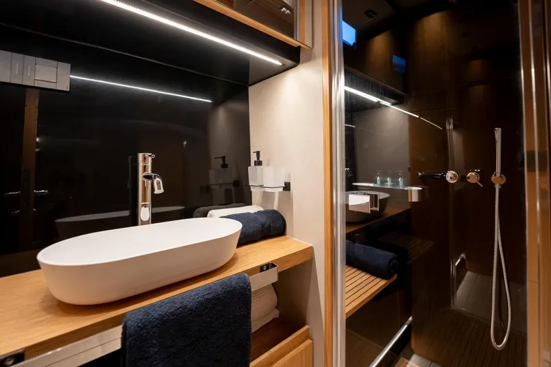 Slide: The Image of Luxurious bathroom interior of 2026 De Antonio Yachts D60, featuring modern sink and shower. - 33