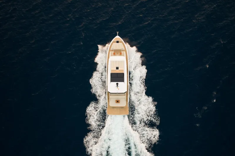 Slide: The Image of Aerial view of 2026 De Antonio Yachts D60 cruising on open sea. - 7