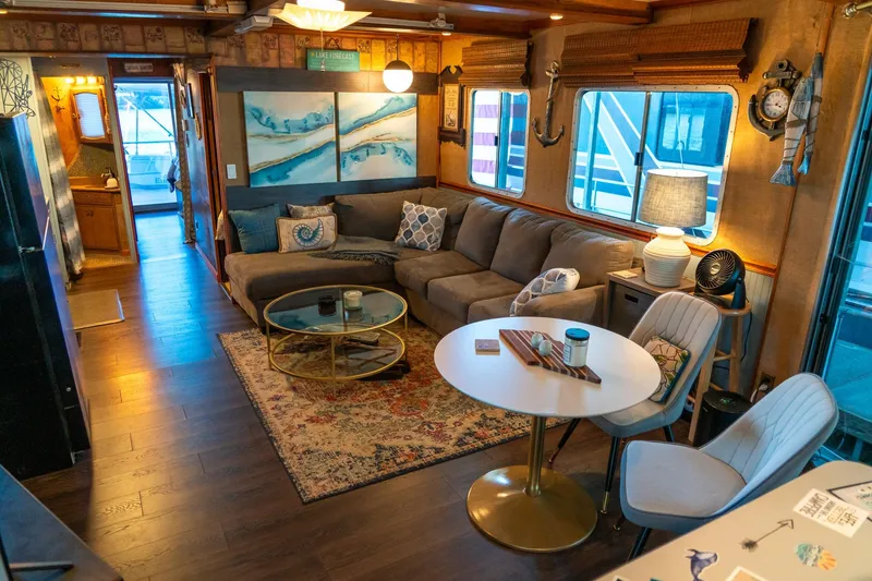Slide: The Image of Cozy interior of 1989 Seabreeze 53 x 14 houseboat with modern decor and comfortable seating. - 8