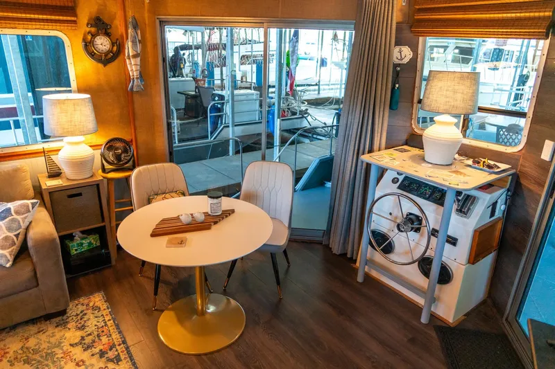 Slide: The Image of Cozy interior of a 1989 Seabreeze 53 x 14 houseboat with nautical decor. - 9