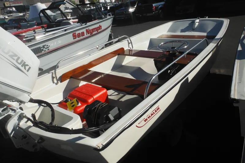 Slide: The Image of 1973 Boston Whaler 13 Sport Side boat with Suzuki outboard motor. - 7