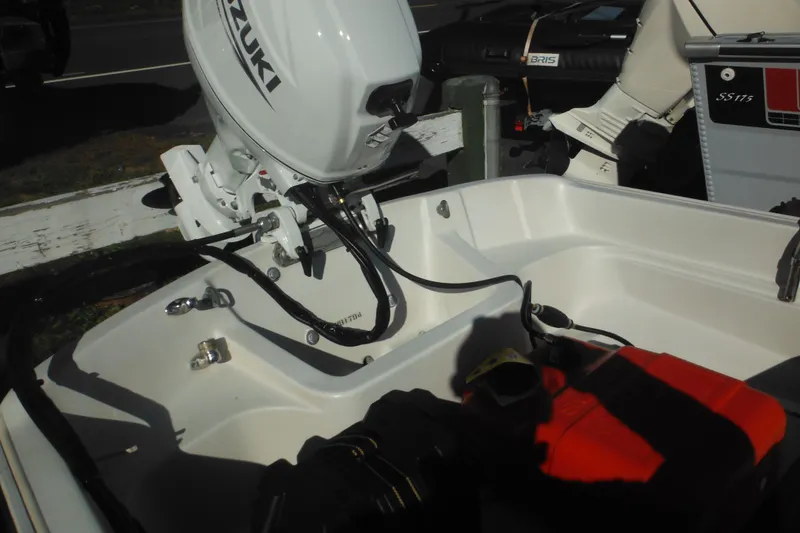 Slide: The Image of 1973 Boston Whaler 13 Sport Side boat with Suzuki outboard motor. - 9