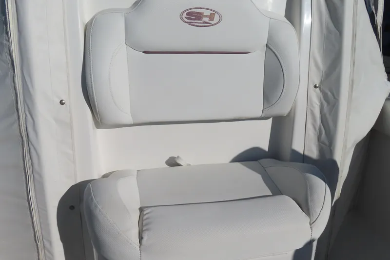 Slide: The Image of White seat on 2018 Sea Hunt Ultra 234 boat, featuring SH logo. - 15