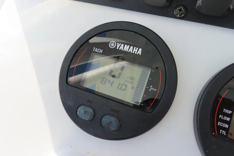 Slide: The Image of Yamaha tachometer on 2018 Sea Hunt Ultra 234 boat dashboard, displaying engine hours. - 20