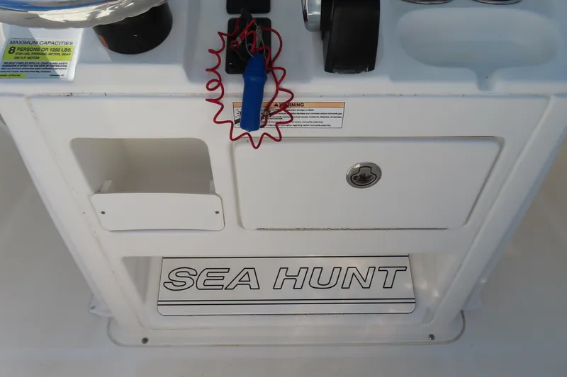 Slide: The Image of 2018 Sea Hunt Ultra 234 boat console with storage and safety features. - 21