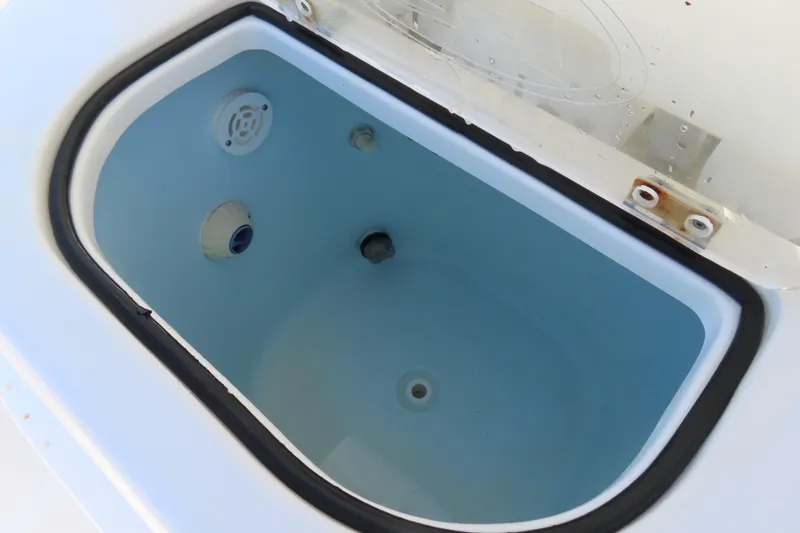 Slide: The Image of Open livewell compartment on 2018 Sea Hunt Ultra 234 boat. - 25