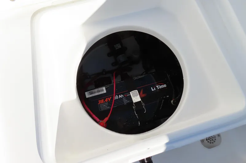 Slide: The Image of Battery compartment of 2018 Sea Hunt Ultra 234 boat, featuring Li Time battery. - 32