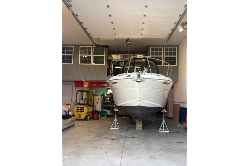 Slide: The Image of 2006 Sea Ray 300 Sundancer boat in garage, front view. - 23