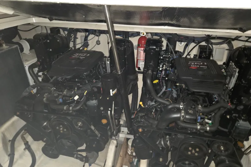 Slide: The Image of Engine room of a 2006 Sea Ray 300 Sundancer with dual MerCruiser engines. - 27
