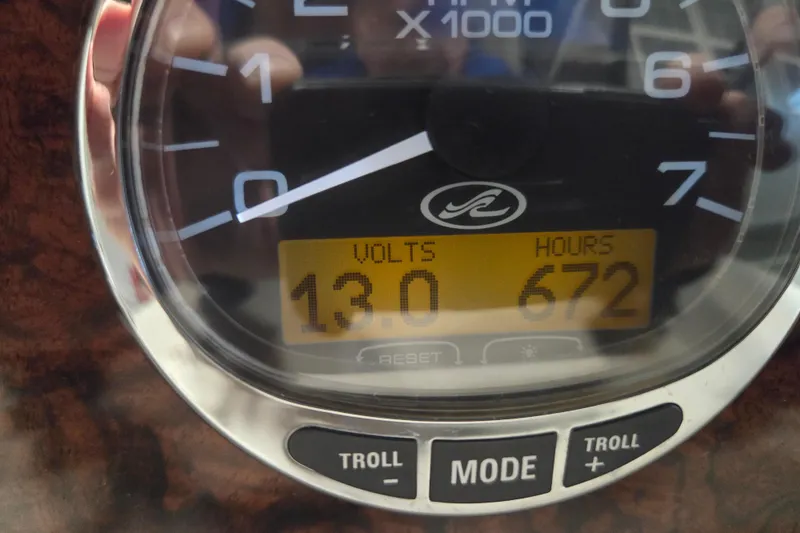 Slide: The Image of Close-up of a 2006 Sea Ray 300 Sundancer gauge showing 13 volts and 672 hours. - 32