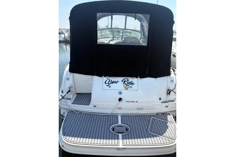 Slide: The Image of 2006 Sea Ray 300 Sundancer boat with black canopy, docked in Holland, MI. - 33