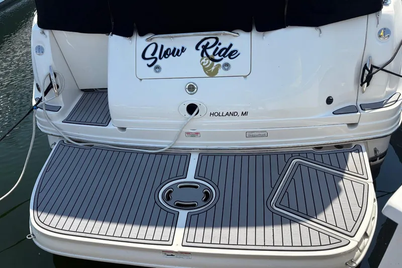 Slide: The Image of 2006 Sea Ray 300 Sundancer boat with custom swim platform, docked in Holland, MI. - 7