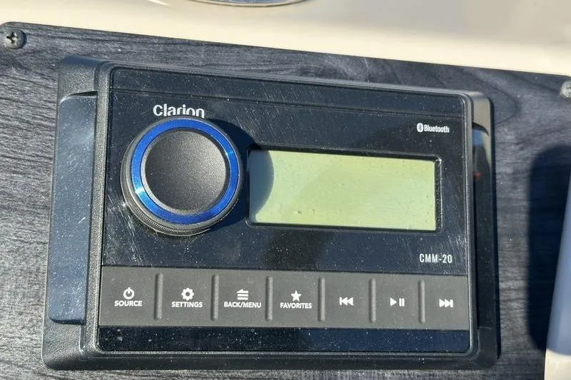 Slide: The Image of Clarion CMM-20 Bluetooth stereo system on 2023 Harris Cruiser 210 CS boat. - 16