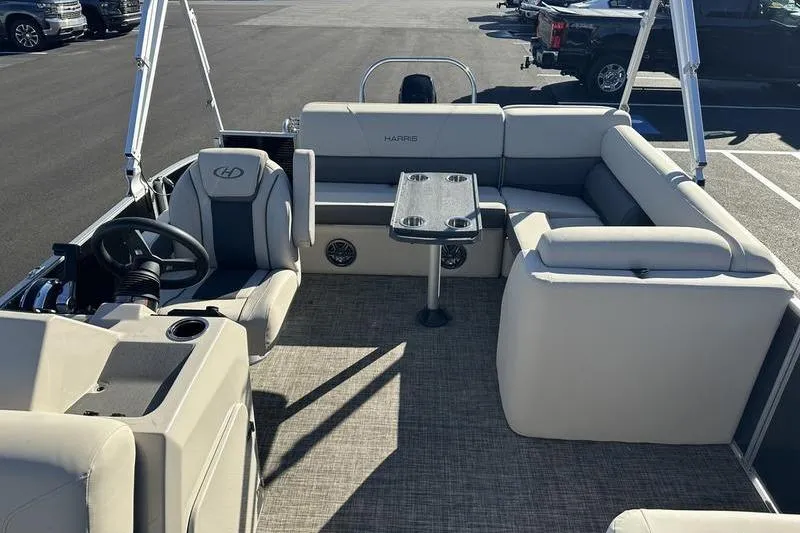 Slide: The Image of 2023 Harris Cruiser 210 CS pontoon boat interior with seating and table. - 9