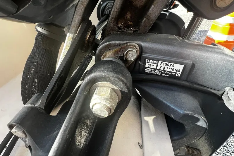 Slide: The Image of Close-up of Yamaha F150XA motor on 2013 Grady-White Freedom 205 boat. - 14