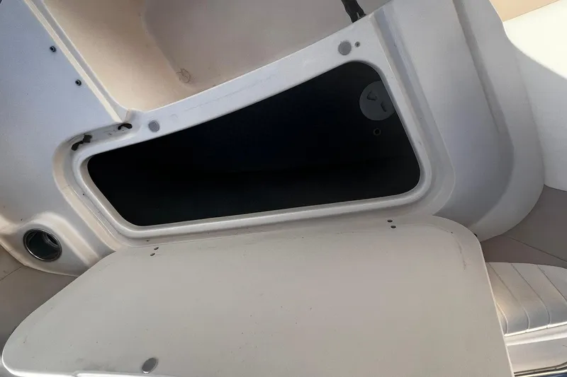 Slide: The Image of Open storage compartment on 2013 Grady-White Freedom 205 boat. - 21