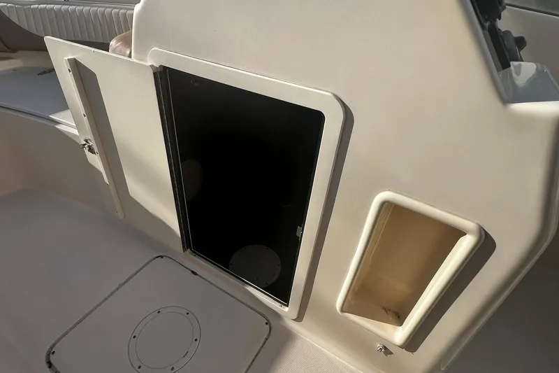 Slide: The Image of 2013 Grady-White Freedom 205 boat interior storage compartment and seating area. - 23
