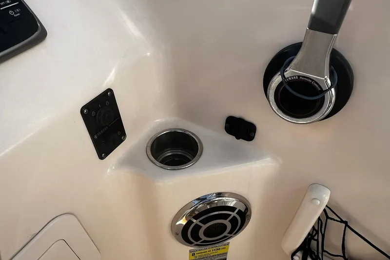Slide: The Image of 2013 Grady-White Freedom 205 boat controls and cup holder detail. - 26