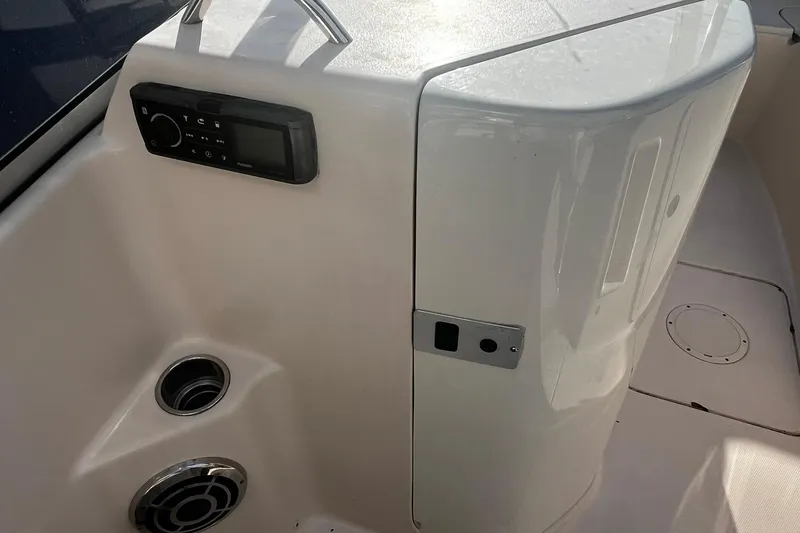 Slide: The Image of 2013 Grady-White Freedom 205 boat interior with control panel and speaker. - 31