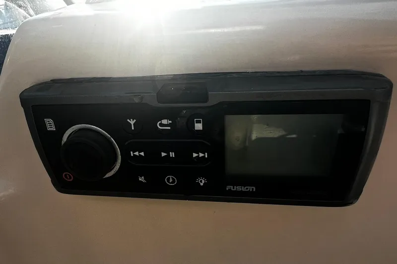 Slide: The Image of Control panel on a 2013 Grady-White Freedom 205 boat, featuring Fusion audio system. - 32