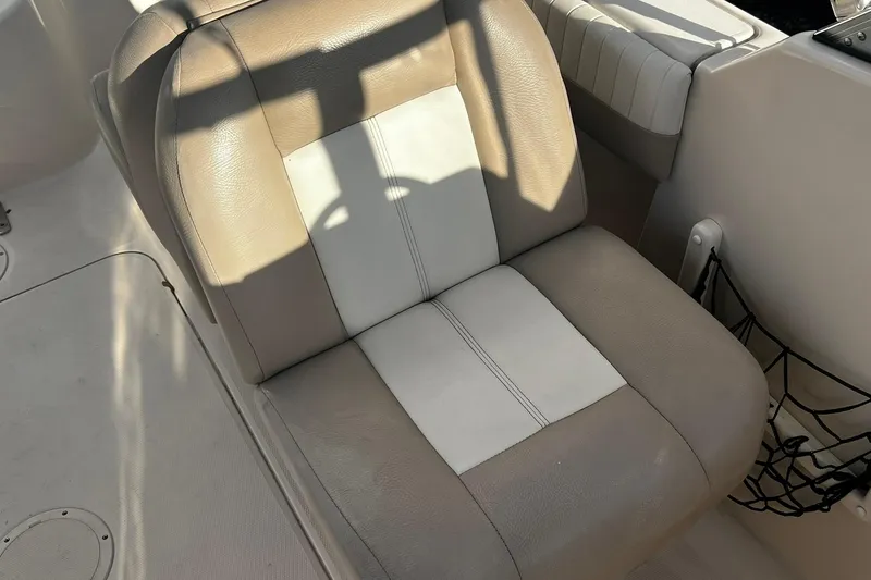 Slide: The Image of Beige and white seat on 2013 Grady-White Freedom 205 boat interior. - 36