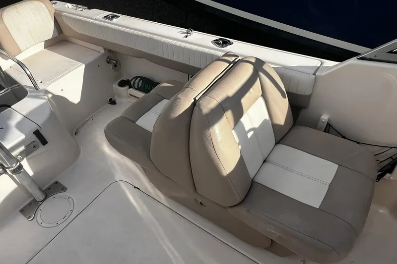 Slide: The Image of 2013 Grady-White Freedom 205 boat interior with beige and white seating. - 37