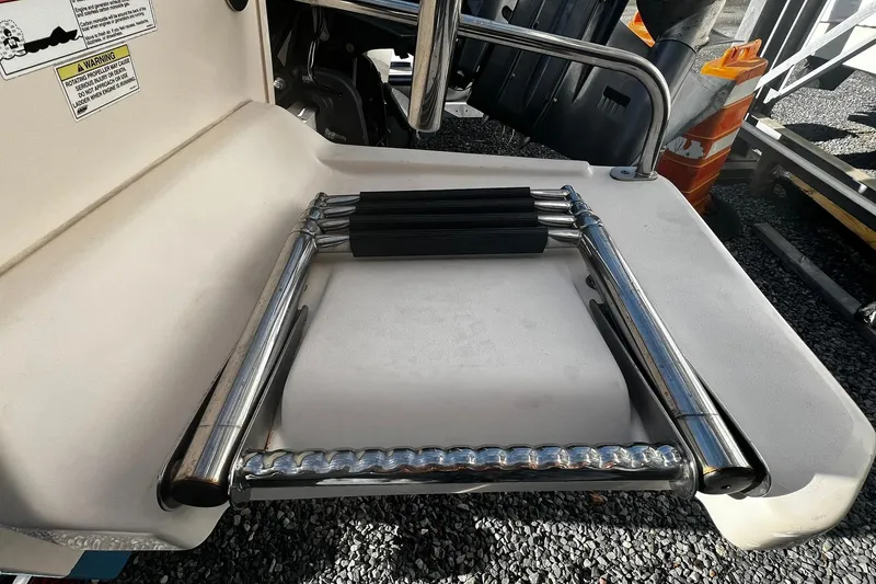 Slide: The Image of 2013 Grady-White Freedom 205 boat ladder on deck, folded and ready for use. - 5