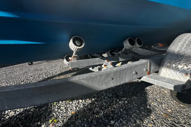 Slide: The Image of Trailer and hull of a 2013 Grady-White Freedom 205 boat on gravel. - 9