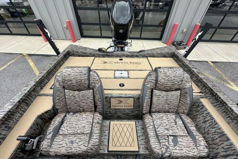 Slide: The Image of 2026 SeaArk ProCat 240 boat interior with camo seats and modern design. - 10