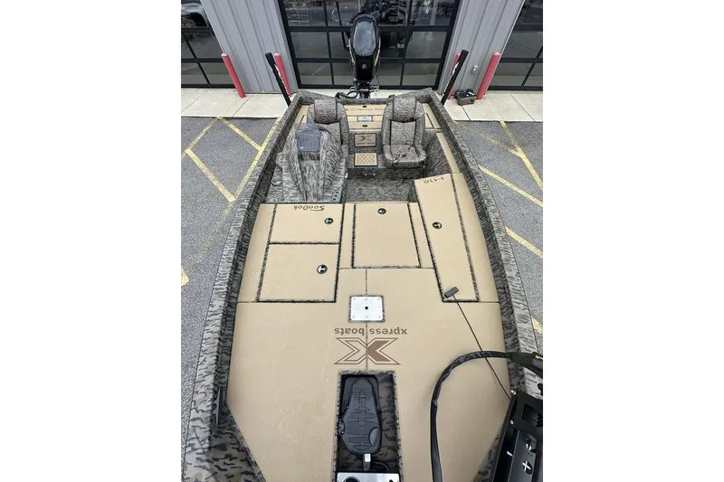 Slide: The Image of 2026 SeaArk ProCat 240 boat interior with spacious deck and seating arrangement. - 13