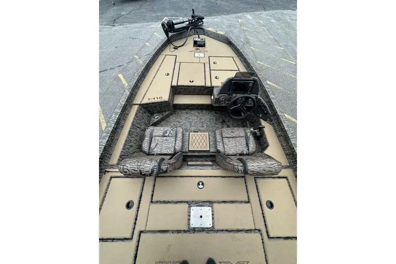 Slide: The Image of 2026 SeaArk ProCat 240 boat interior with steering wheel and seating. - 4