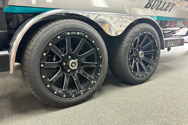 Slide: The Image of 2025 Bullet 21SDC boat trailer with black alloy wheels and Capricorn tires. - 15